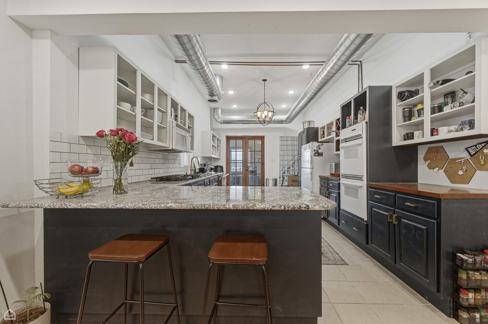 822 North Wood Street Chicago, IL 60622 - Photo 7 of 28 a kitchen with stainless steel appliances granite countertop a sink and cabinets