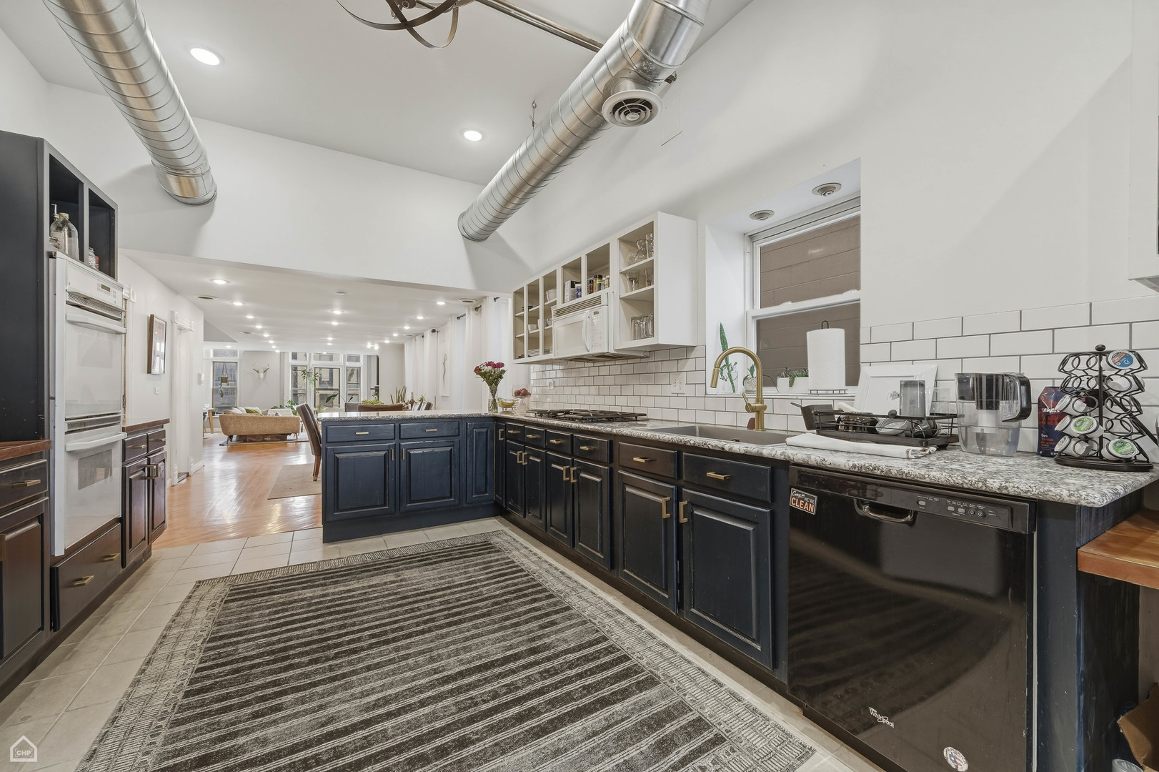 822 North Wood Street Chicago, IL 60622 - Photo 8 of 28 a large kitchen with stainless steel appliances granite countertop a sink and cabinets
