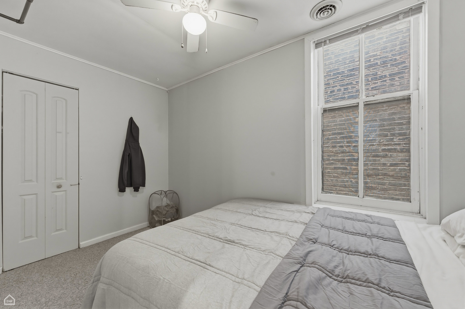 822 North Wood Street Chicago, IL 60622 - Photo 9 of 28 a bedroom with a bed and a window