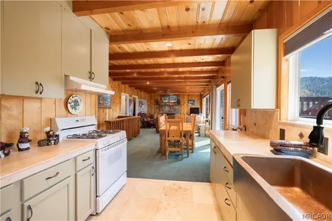 a kitchen that has a lot of cabinets in it