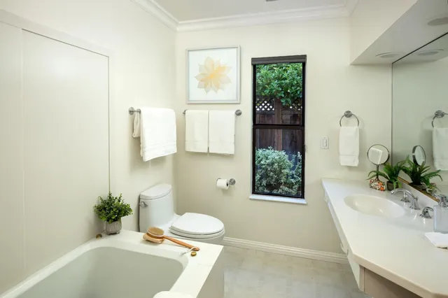 a bathroom with a sink a toilet and tub