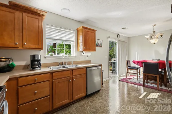 a kitchen that has a cabinets counter space and a window