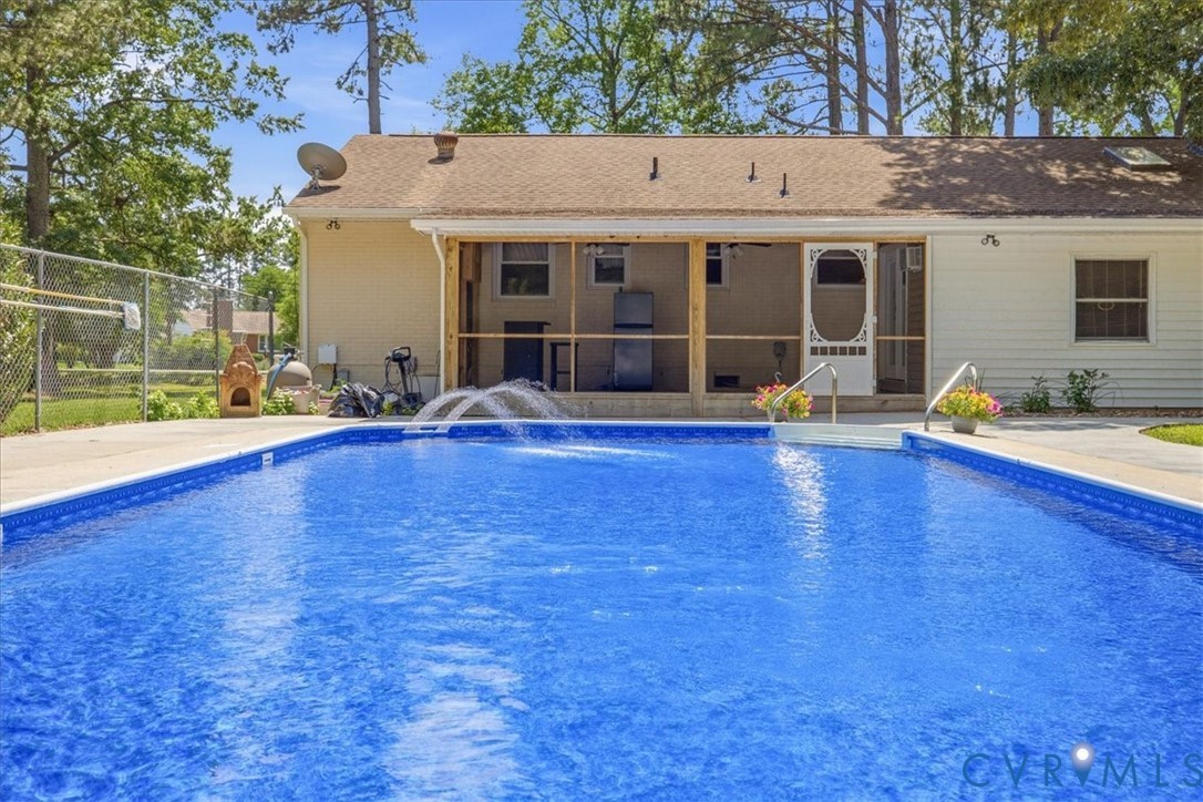 404 Bermuda Hundred Road Chester, VA 23836 - Photo 34 of 37 In-ground swimming pool with integrated water feat