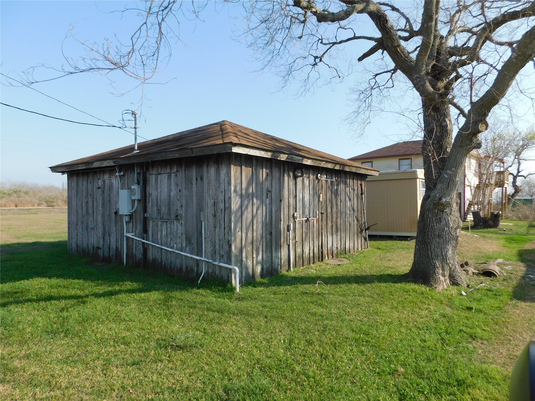 266 First Street Port Lavaca, TX 77979 - Photo 1 of 18 a backyard of a house with lots of green space
