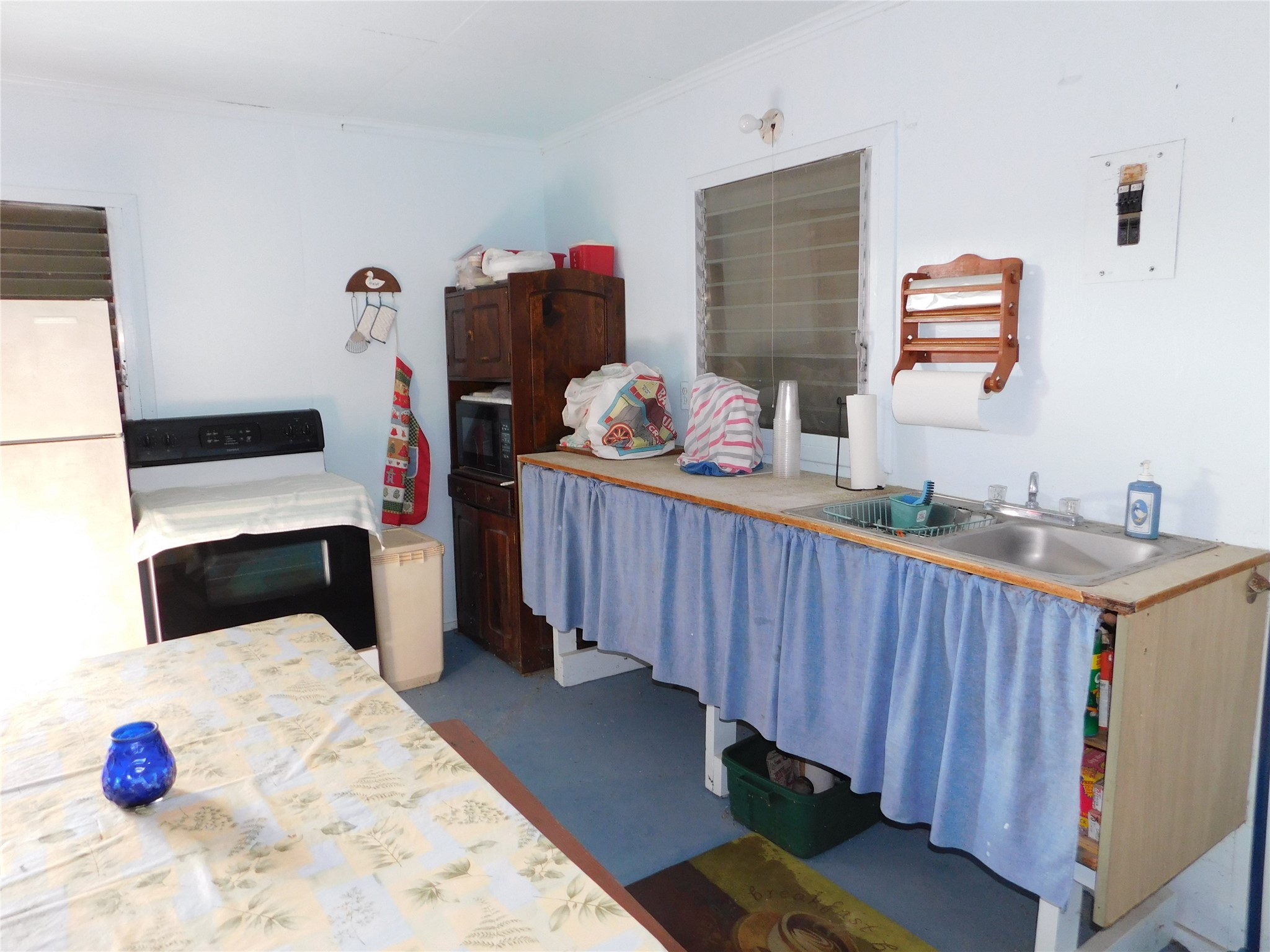 266 First Street Port Lavaca, TX 77979 - Photo 2 of 18 a bedroom with a bed and a view of kitchen