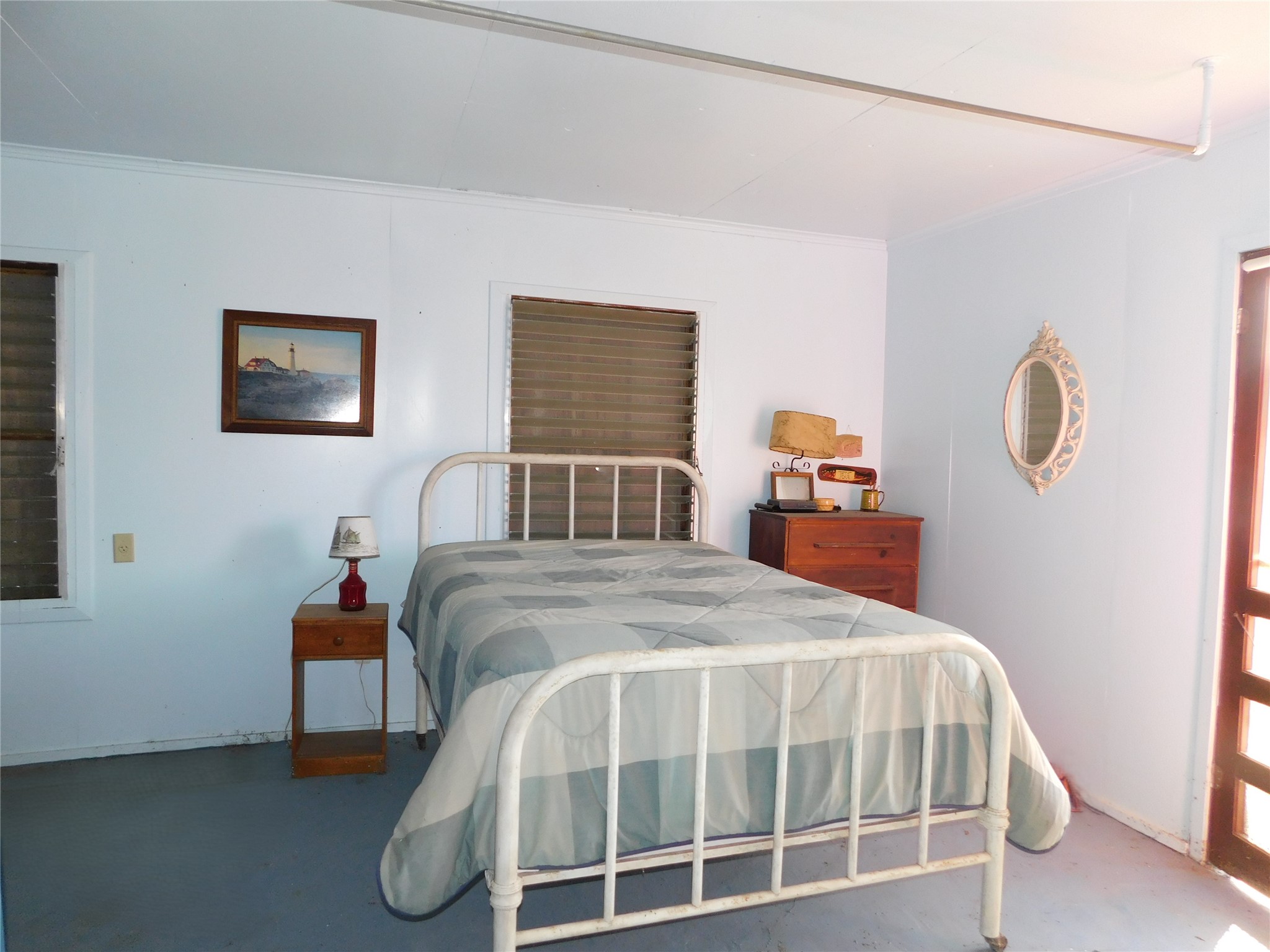 266 First Street Port Lavaca, TX 77979 - Photo 4 of 18 a bedroom with a bed and window
