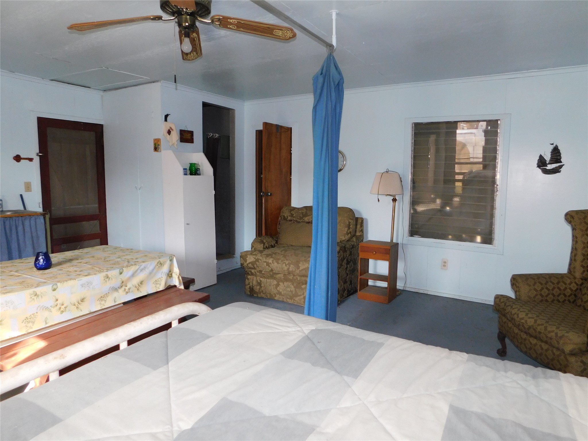 266 First Street Port Lavaca, TX 77979 - Photo 7 of 18 a bedroom with a large bed and a couch