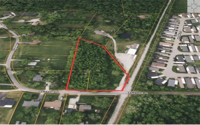 an aerial view of a residential houses with outdoor space