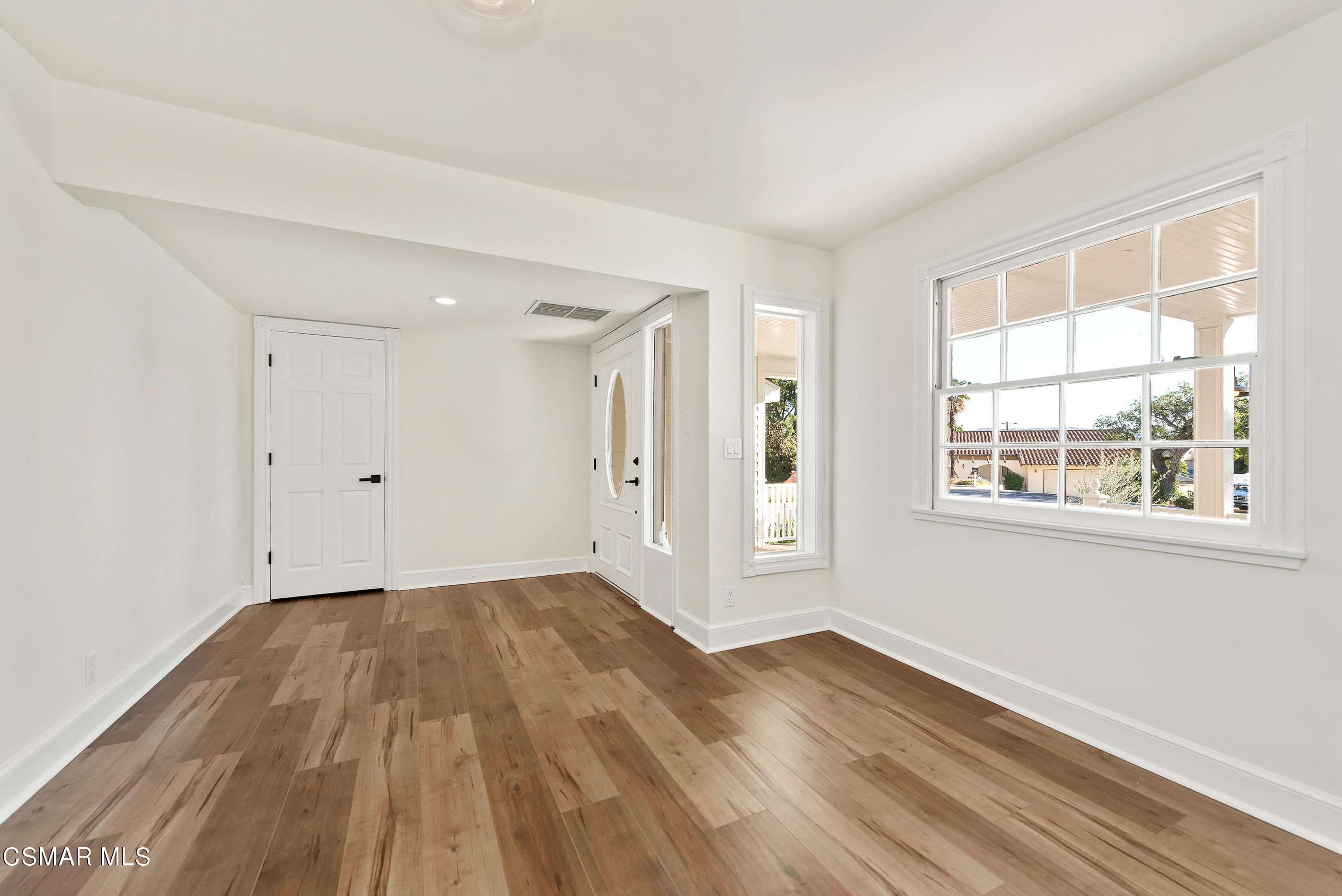 2959 Happy Lane Simi Valley, CA 93065 - Photo 14 of 92 a view of an empty room with wooden floor and a window
