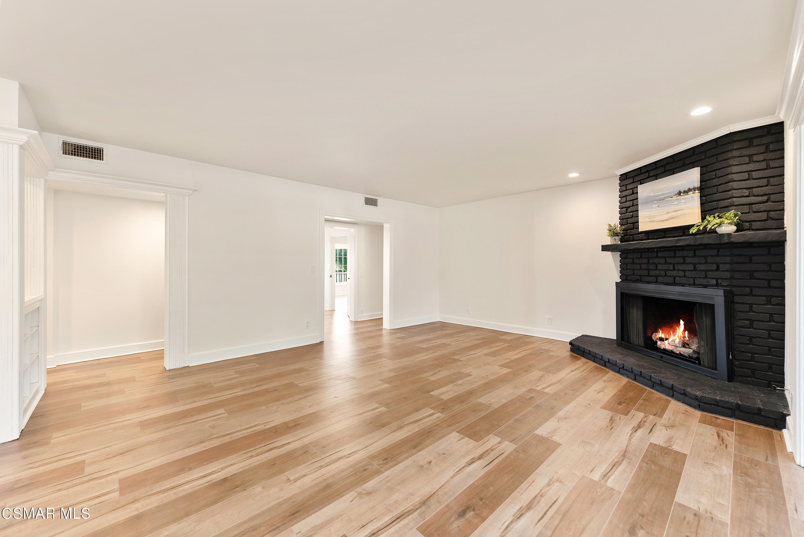2959 Happy Lane Simi Valley, CA 93065 - Photo 16 of 92 a view of an empty room with a fireplace and a window