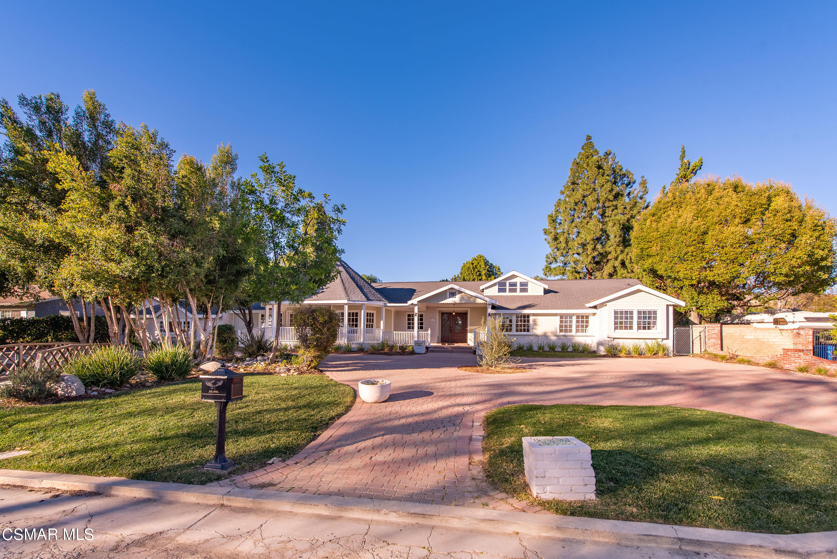 2959 Happy Lane Simi Valley, CA 93065 - Photo 3 of 92 a front view of a house with a yard table and chairs