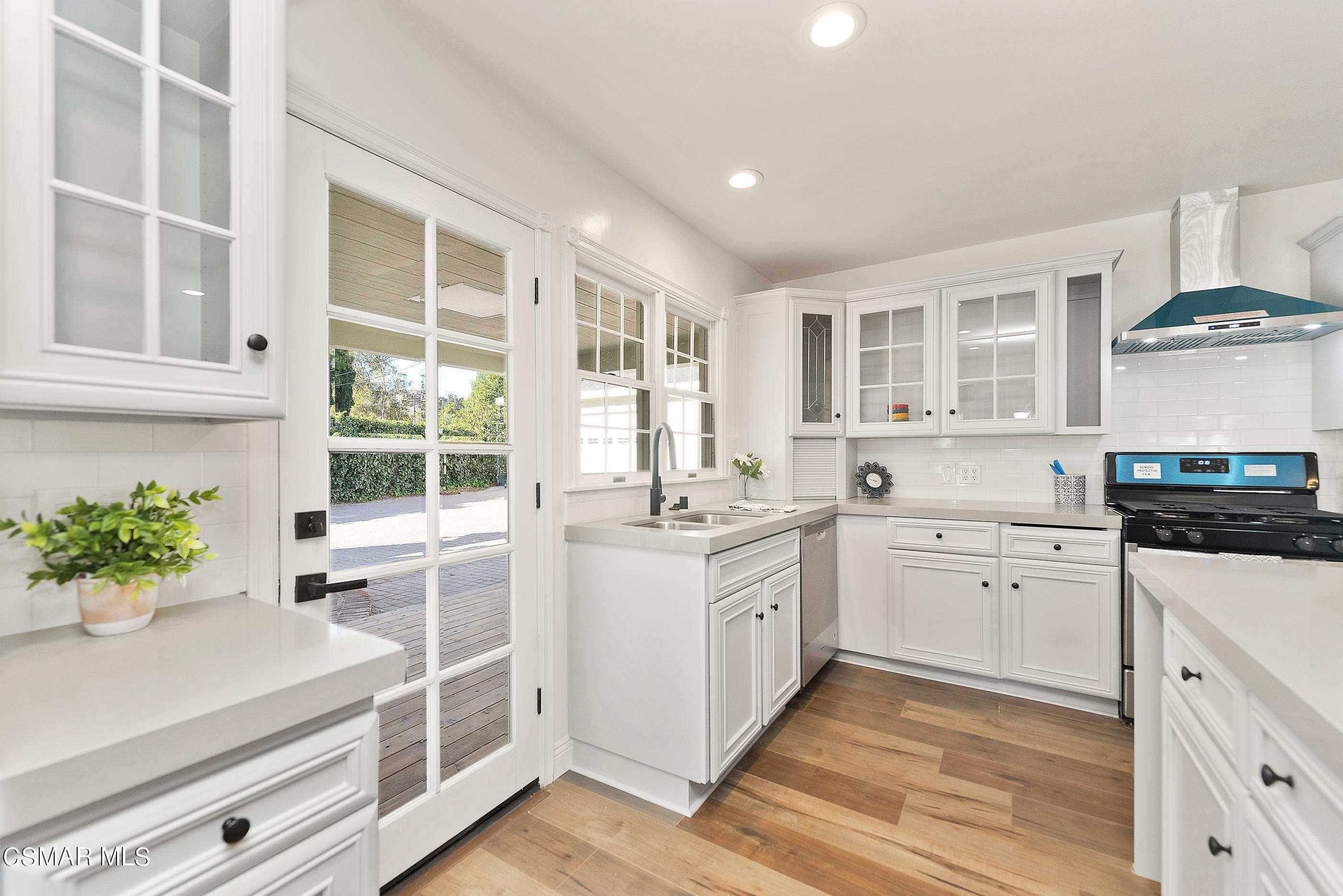 2959 Happy Lane Simi Valley, CA 93065 - Photo 22 of 92 a kitchen with stainless steel appliances white cabinets and a stove top oven