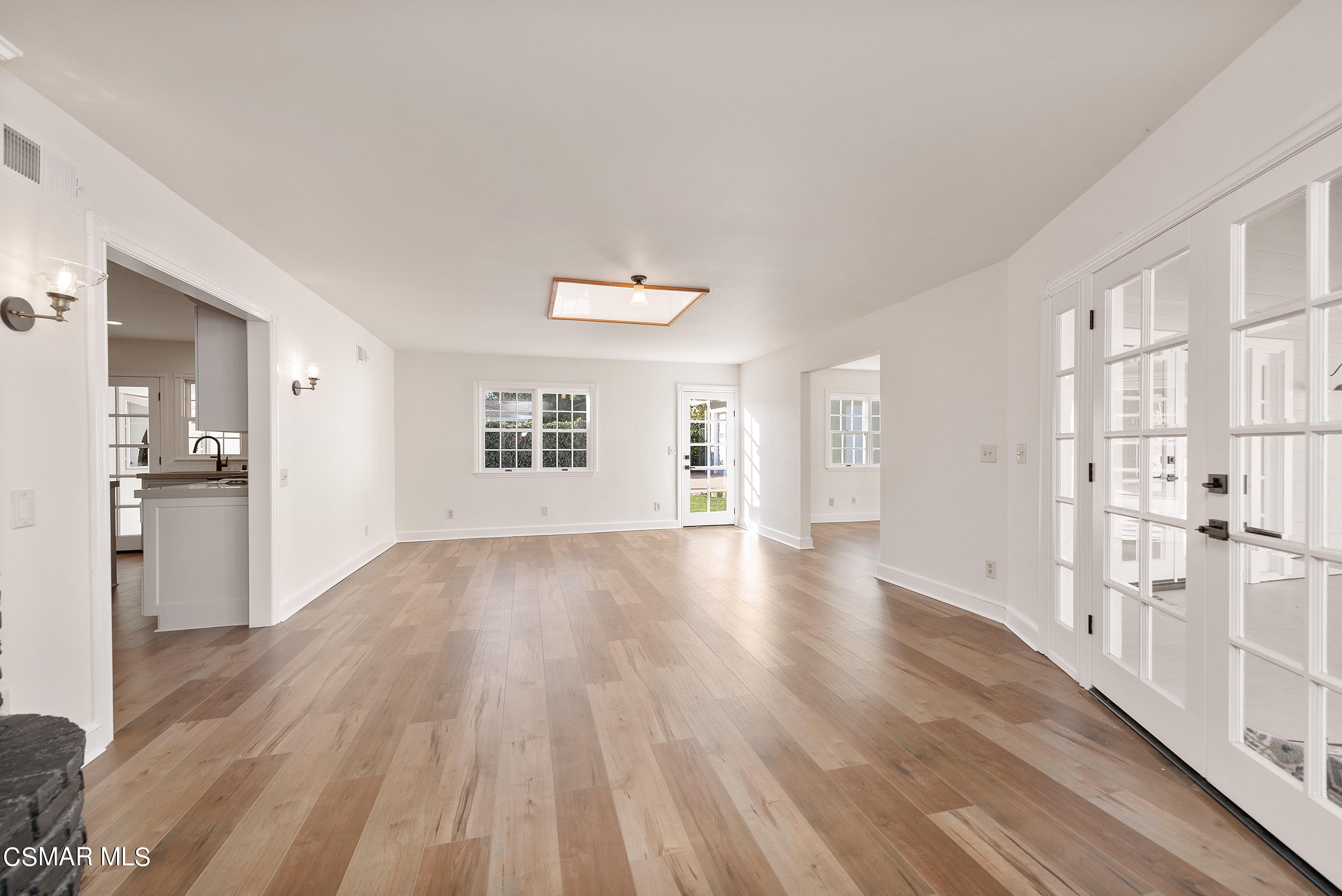 2959 Happy Lane Simi Valley, CA 93065 - Photo 33 of 92 a view of a big room with wooden floor and a kitchen