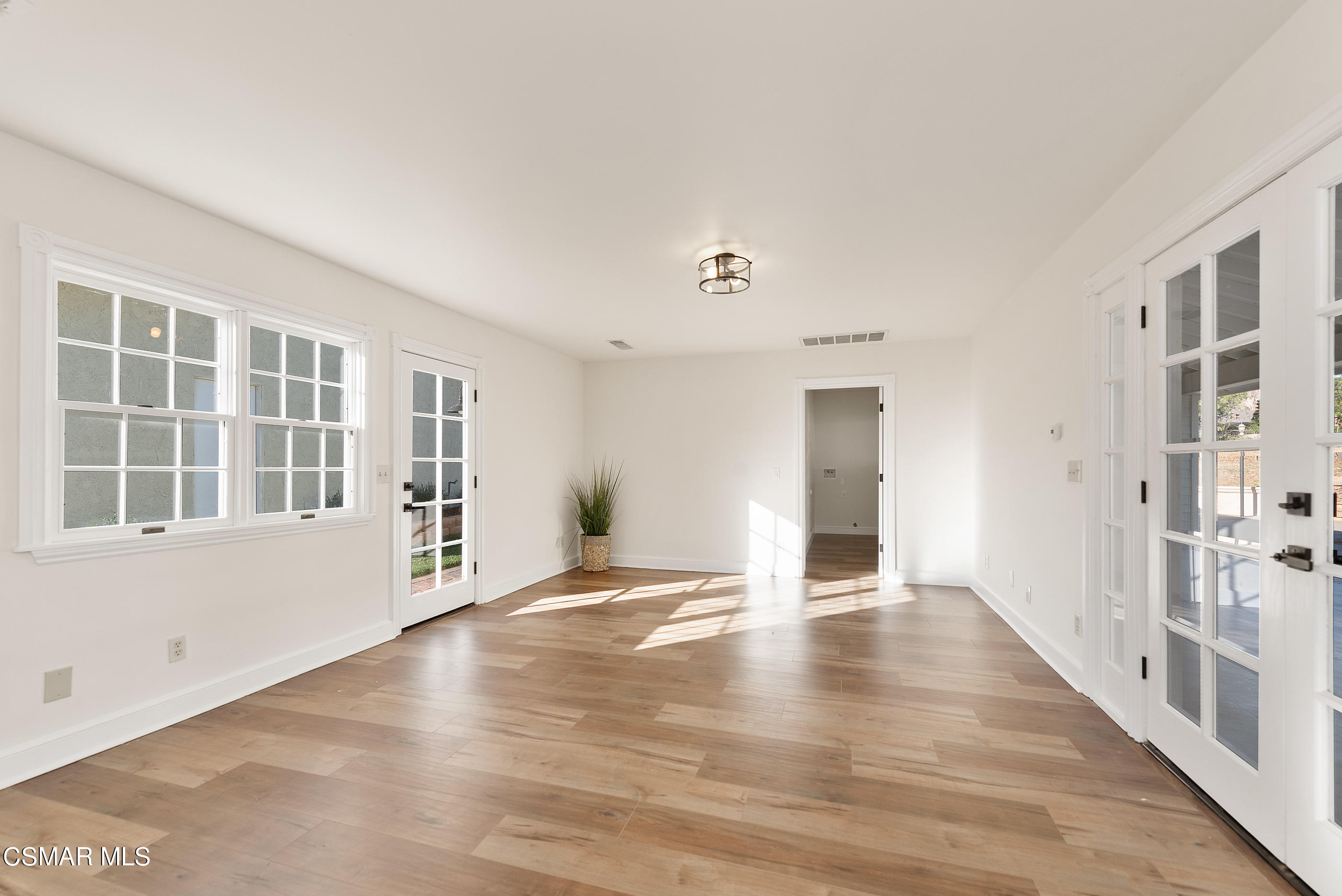 2959 Happy Lane Simi Valley, CA 93065 - Photo 36 of 92 a view of an empty room with wooden floor and a window