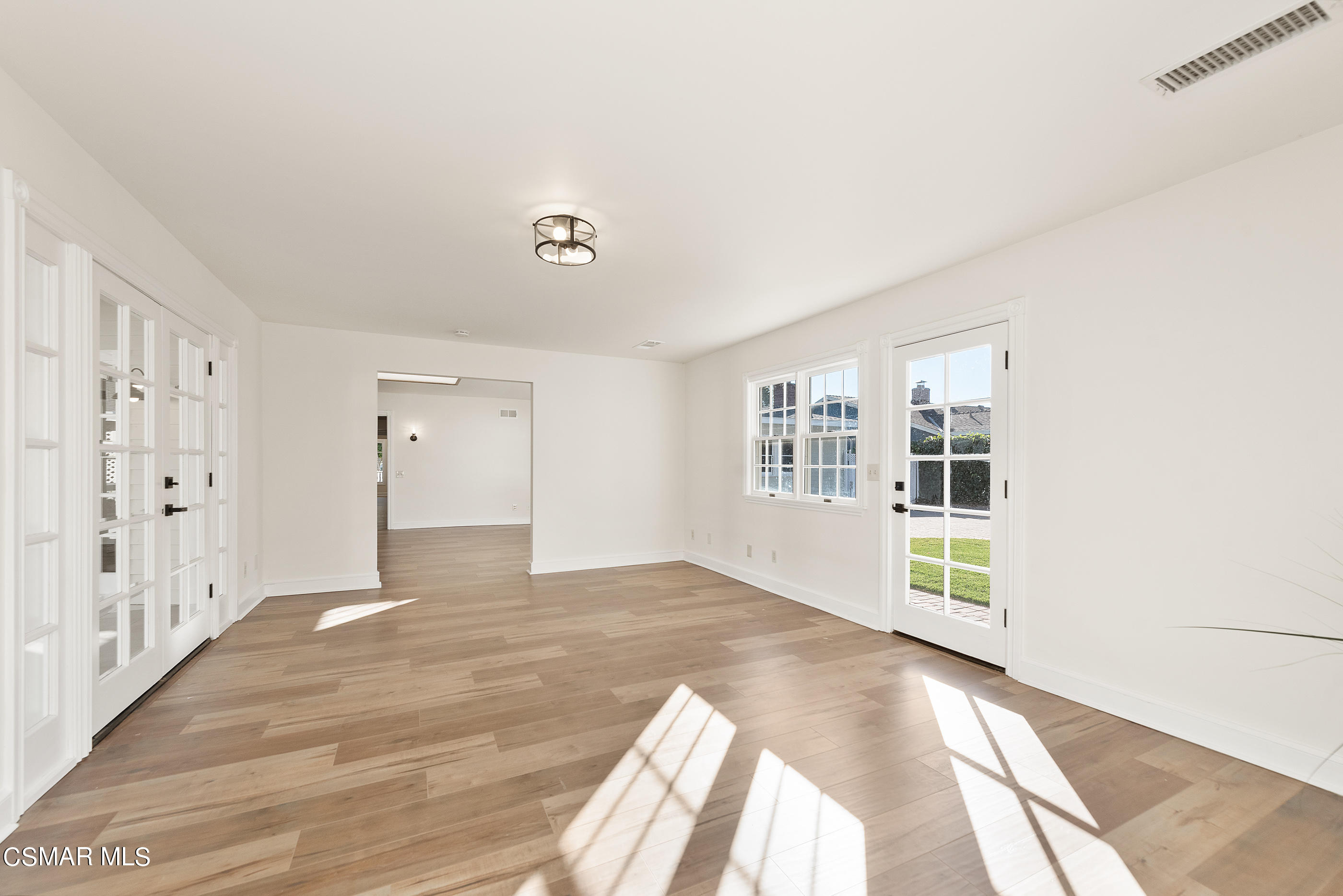 2959 Happy Lane Simi Valley, CA 93065 - Photo 37 of 92 a view of an empty room with window and wooden floor