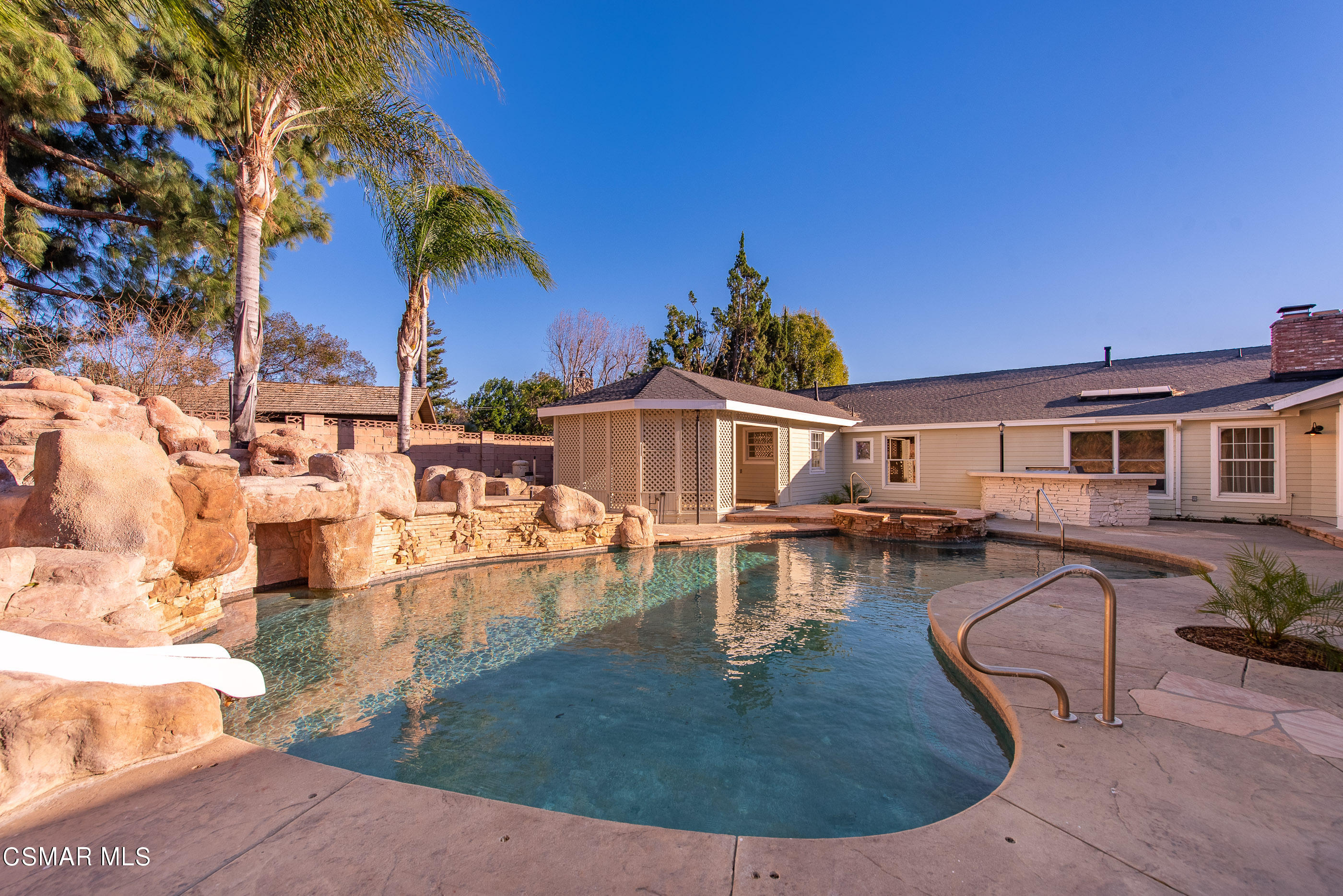 2959 Happy Lane Simi Valley, CA 93065 - Photo 72 of 92 a view of a swimming pool with a lounge chairs