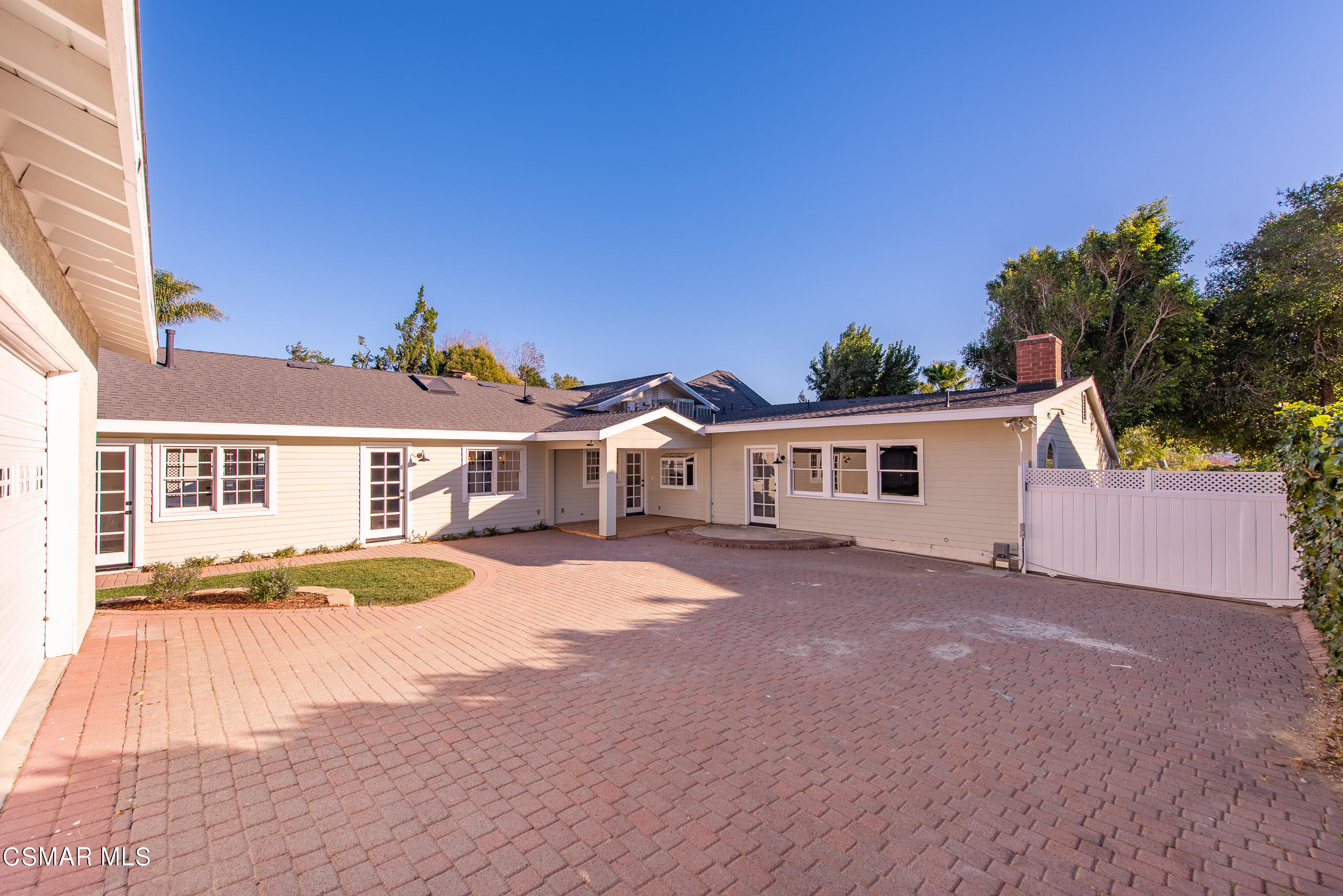 2959 Happy Lane Simi Valley, CA 93065 - Photo 85 of 92 a front view of a house with a yard and potted plants