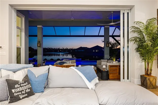 a bedroom with a bed and a potted plant