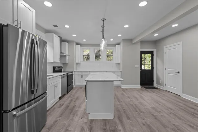 a bathroom with a sink vanity and mirror