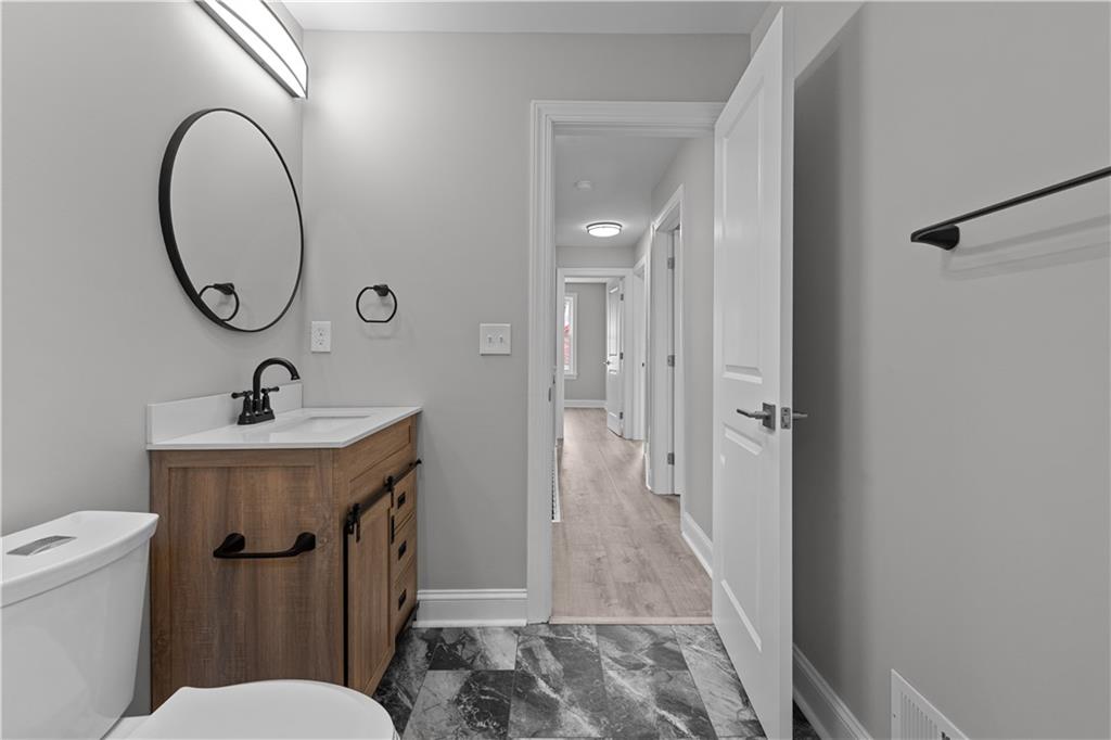 748 Anaheim Street Pittsburgh, PA 15219 - Photo 18 of 29 a bathroom with a sink and a mirror