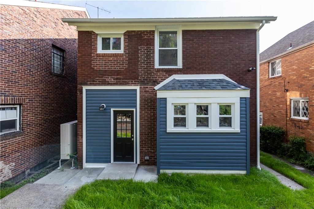 748 Anaheim Street Pittsburgh, PA 15219 - Photo 29 of 29 a front view of a house with a yard