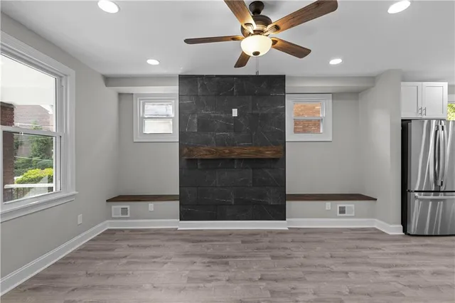wooden floor in an empty room with a window
