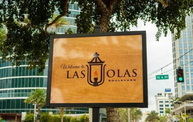 a kitchen with granite countertop a stove a sink and a microwave