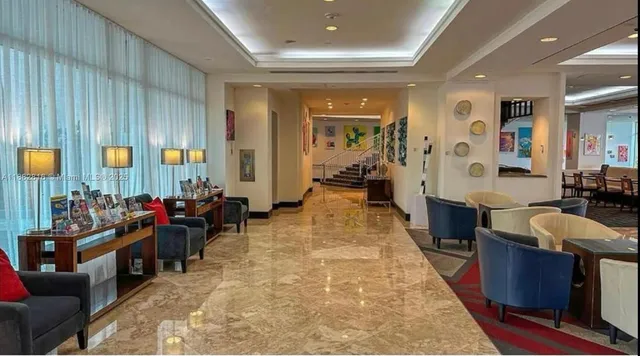 a view of a chairs and table in the patio