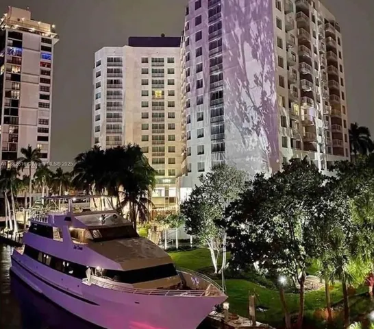 a view of swimming pool with a table and chairs