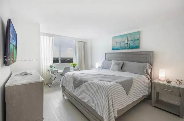 a bedroom with a bed and a couch