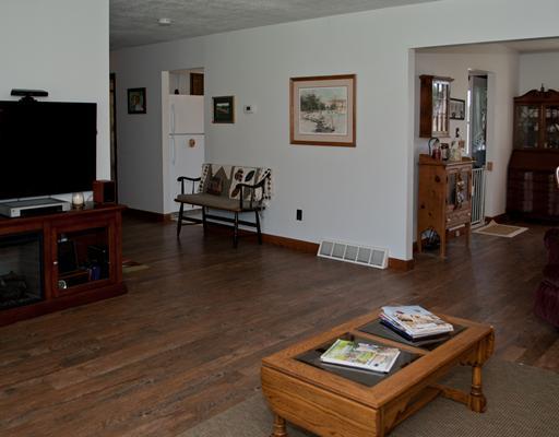 66 Henry Road Tarentum, PA 15084 - Photo 3 of 17 Living Room. Ample sized living room with rustic wood laminate flooring open to the dining room.