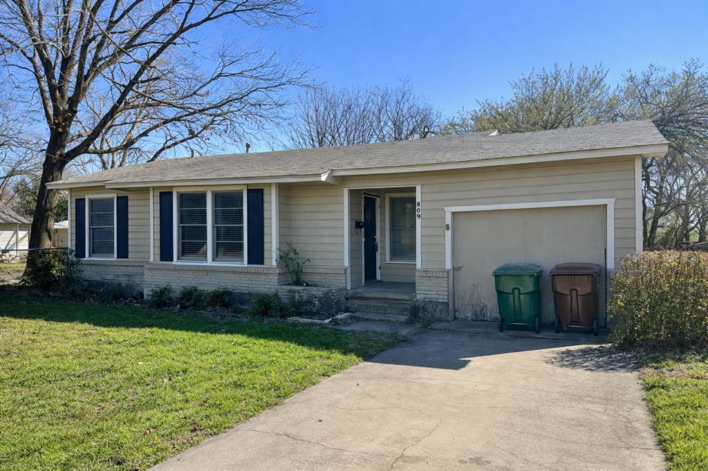 809 Crescent Street Denton, TX 76201 - Photo 2 of 24 a front view of a house with garden