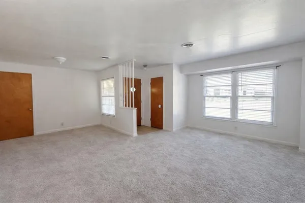 an empty room with windows