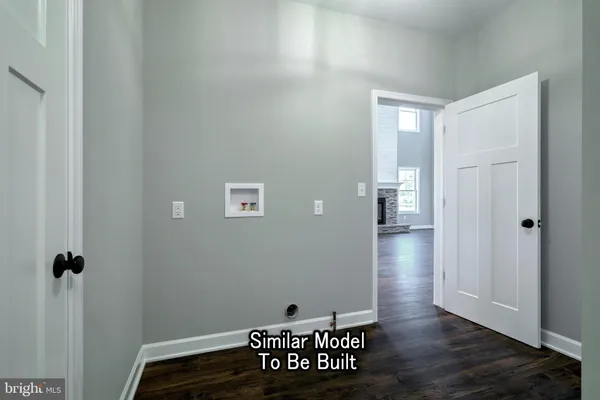 a bathroom with a sink and mirror with window
