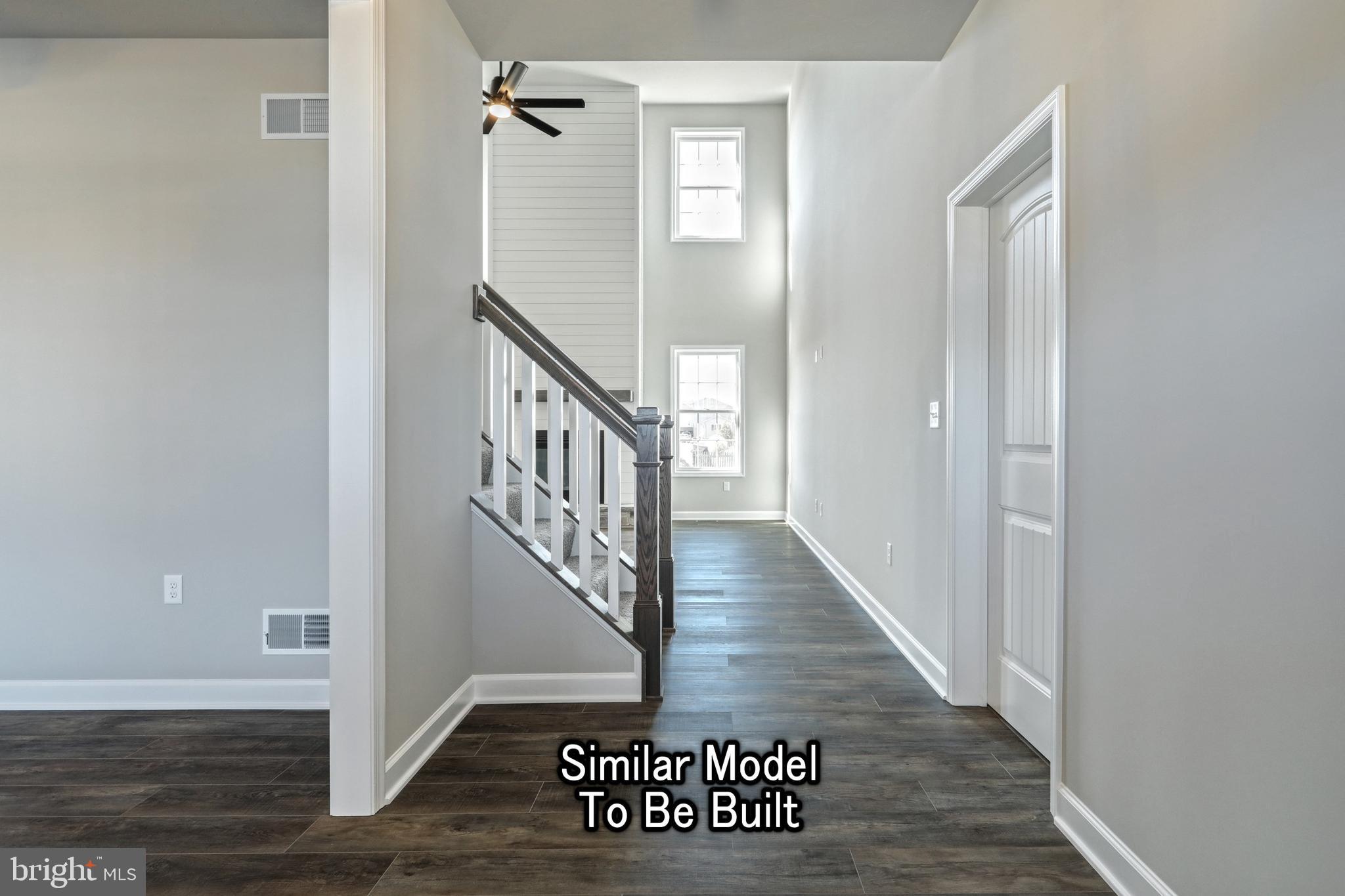 3227 Oxford Road New Oxford, PA 17350 - Photo 37 of 66 a view of a hallway with wooden floor and staircase