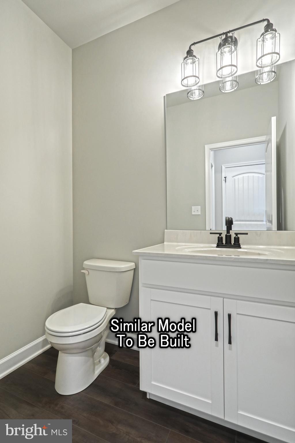 3227 Oxford Road New Oxford, PA 17350 - Photo 50 of 66 a bathroom with a toilet a sink and a mirror
