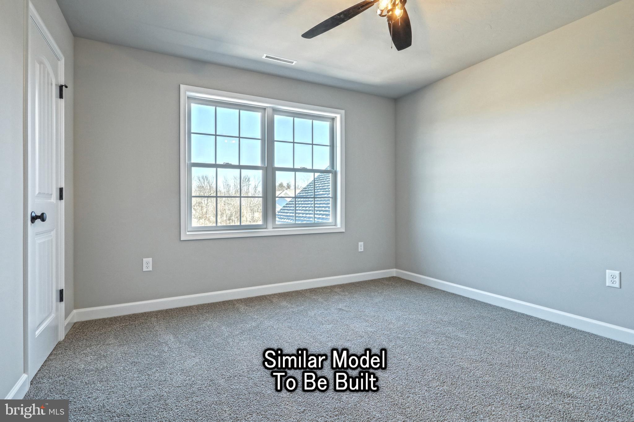 3227 Oxford Road New Oxford, PA 17350 - Photo 52 of 66 an empty room with windows and fan