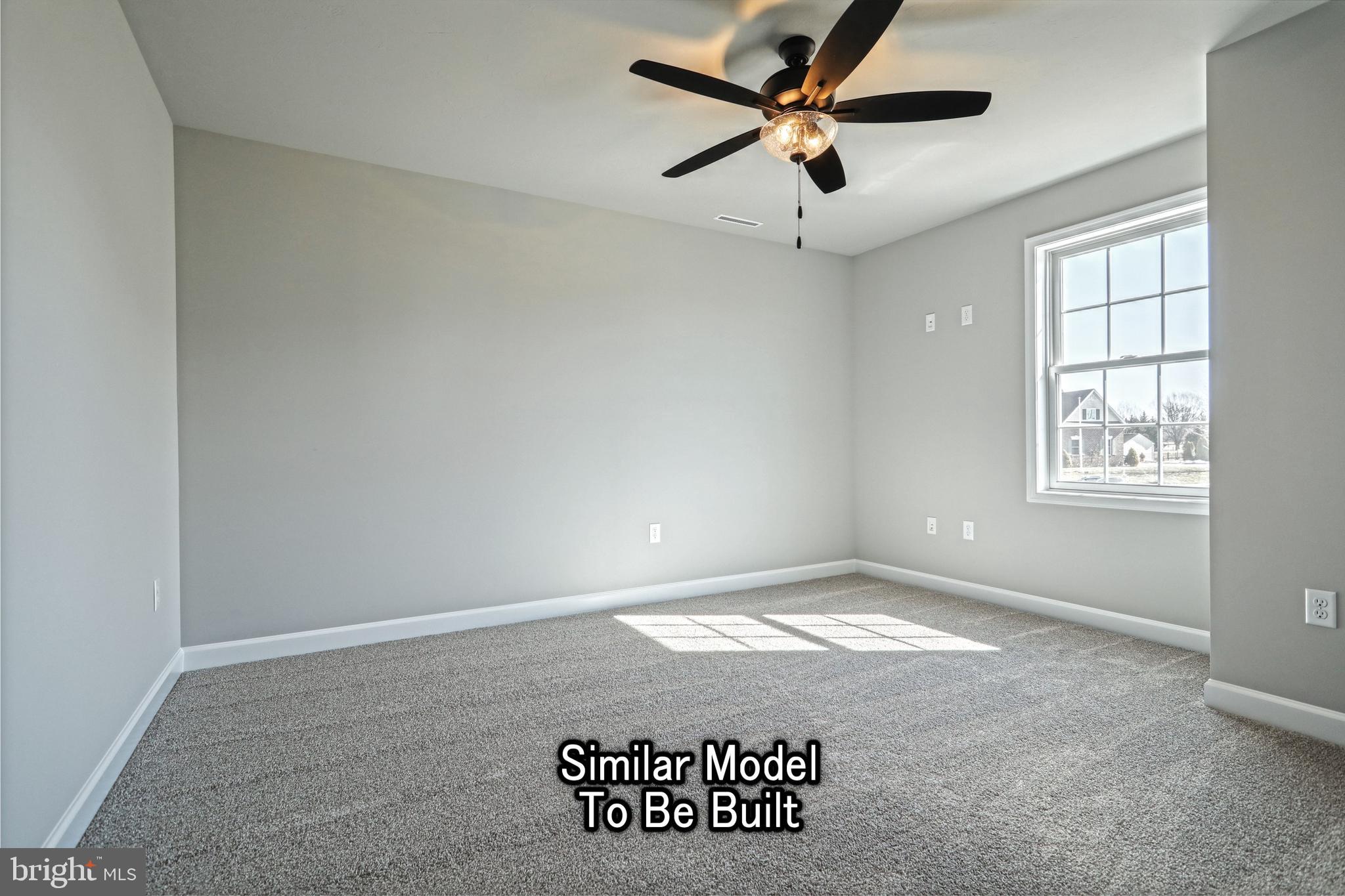 3227 Oxford Road New Oxford, PA 17350 - Photo 57 of 66 an empty room with windows and ceiling fan