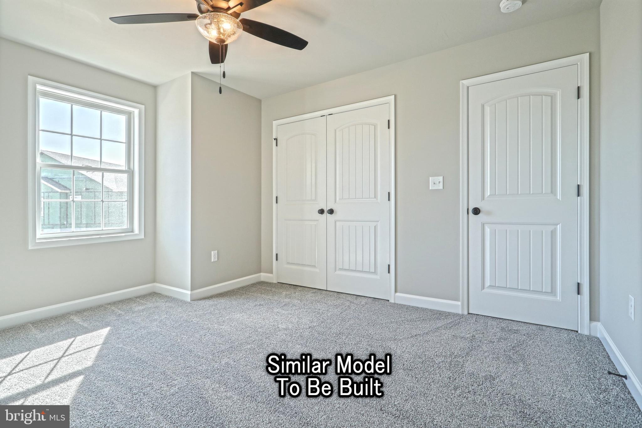 3227 Oxford Road New Oxford, PA 17350 - Photo 58 of 66 a view of an empty room with window and ceiling fan