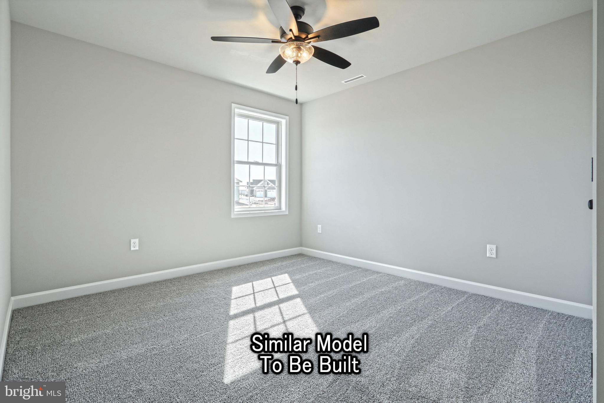 3227 Oxford Road New Oxford, PA 17350 - Photo 59 of 66 an empty room with windows and ceiling fan