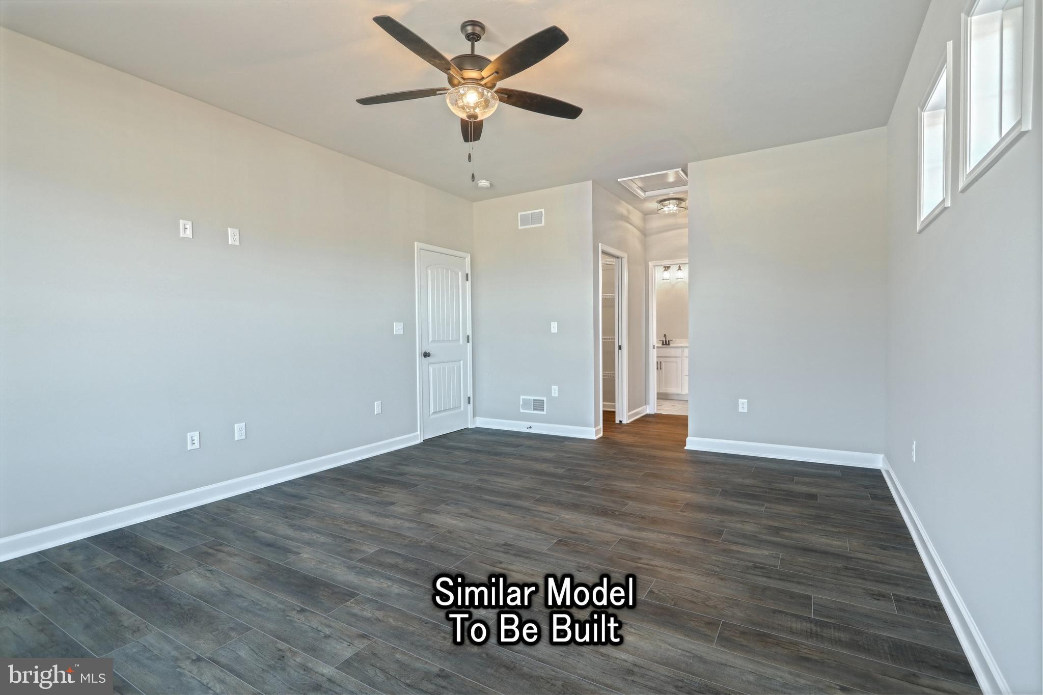 3227 Oxford Road New Oxford, PA 17350 - Photo 65 of 66 an empty room with wooden floor and a ceiling fan