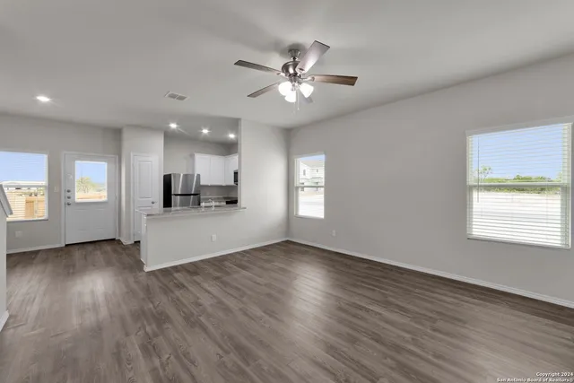 a view of kitchen with sink and wooden floor