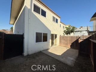 249 East Jackson Street, Unit C Rialto, CA 92376 - Photo 11 of 12 a front view of a house with a yard
