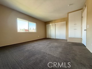 249 East Jackson Street, Unit C Rialto, CA 92376 - Photo 8 of 12 an empty room with windows