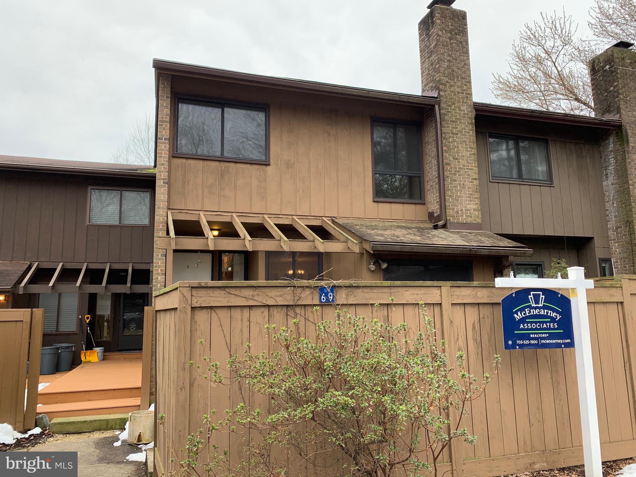 11969 Greywing Court Reston, VA 20191 - Photo 1 of 4 a front view of a house with parking
