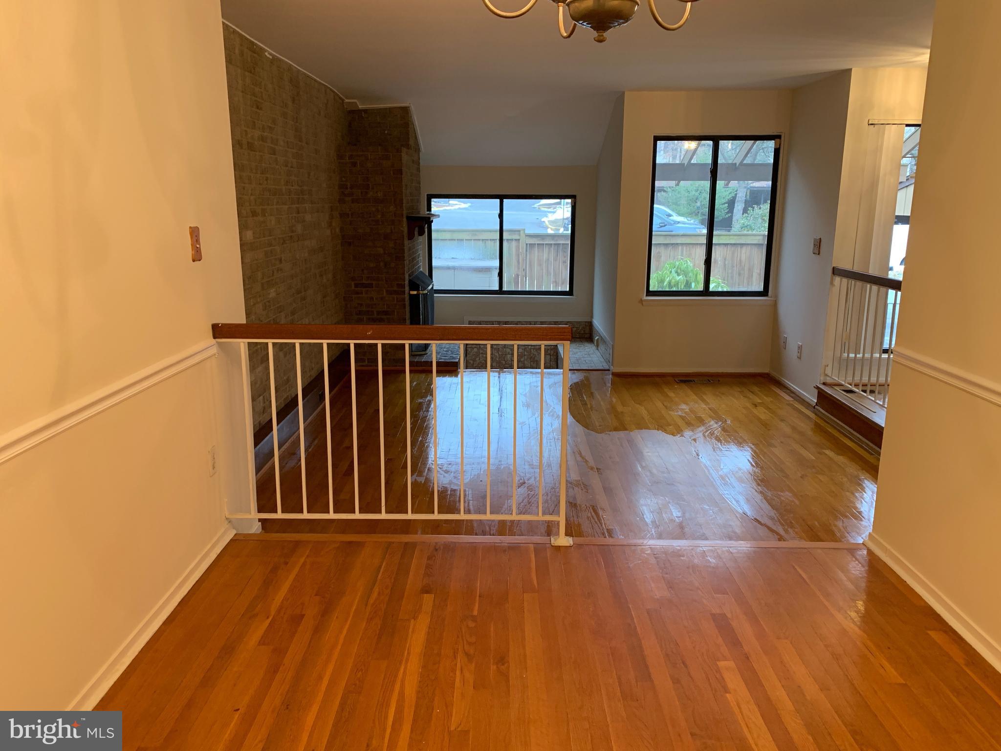 11969 Greywing Court Reston, VA 20191 - Photo 4 of 4 an empty room with wooden floor and windows