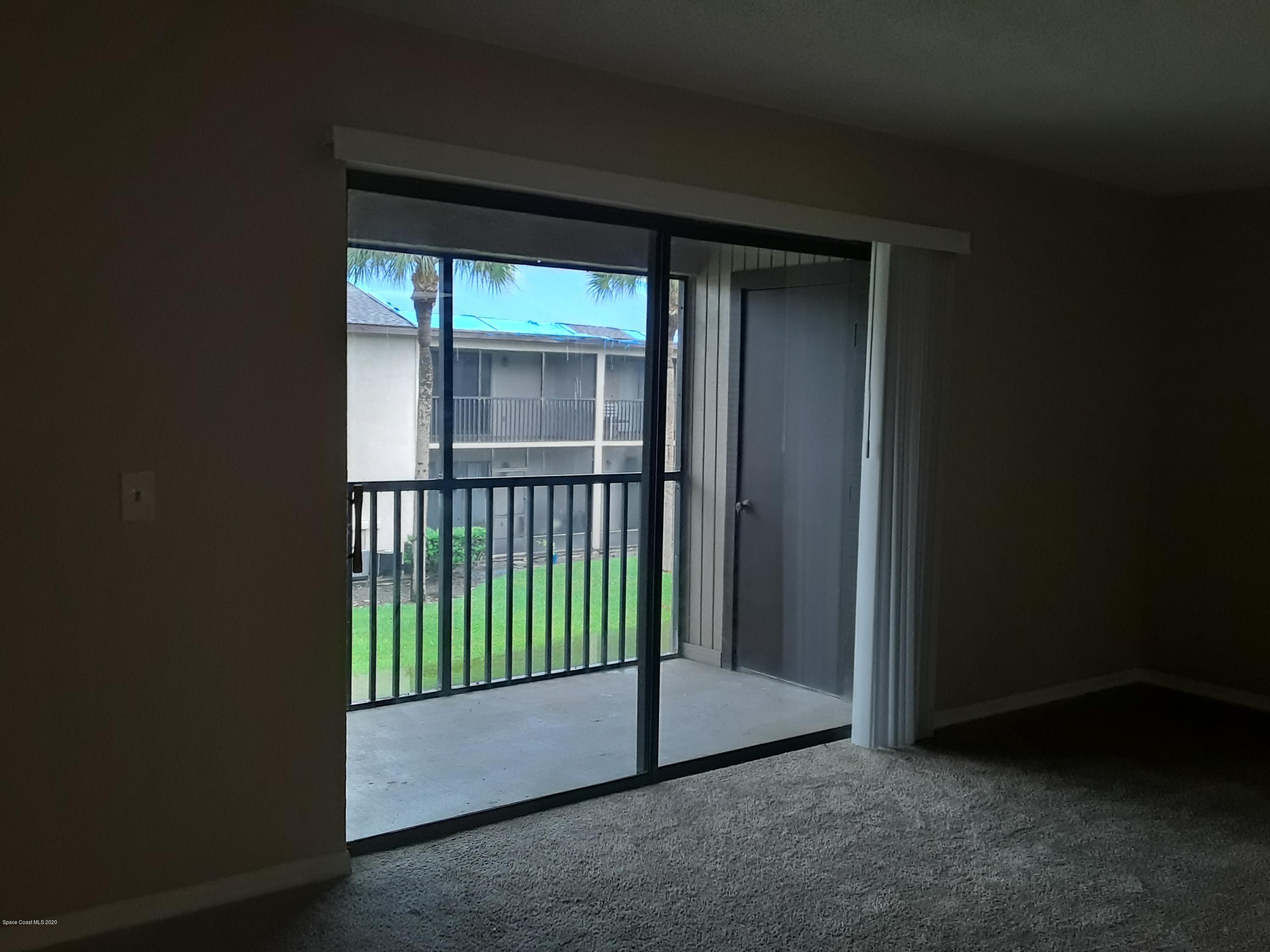 1049 June Drive Melbourne, FL 32935 - Photo 6 of 12 a view of a room that has a large window
