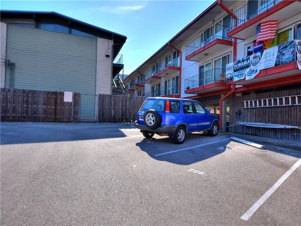 a view of a car parked front of a house