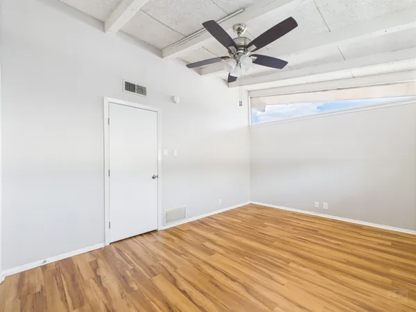 a view of a big room with wooden floor
