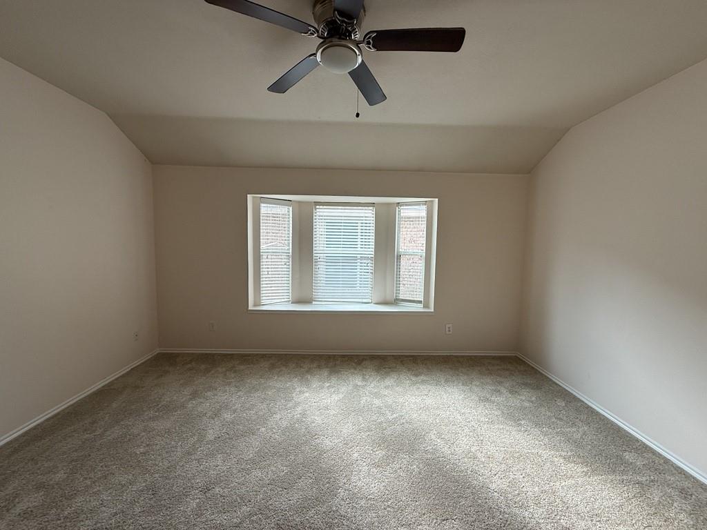2224 Hummingbird Way Mesquite, TX 75181 - Photo 19 of 28 an empty room with a window and a fan